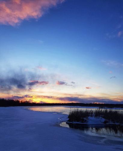 The Rideau River in Smiths Falls, Ontario Canada on a brutally cold winter afternoon