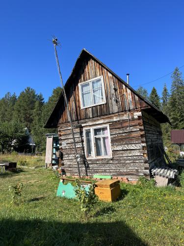 Some tilted old house in the village of Sagra, Russia