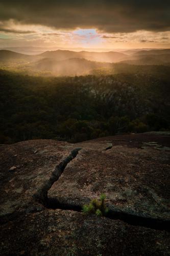 A moody, rainy sunset lights up the Granite Belt, Queensland, Australia OC