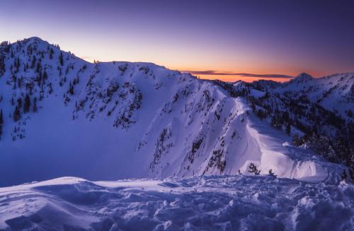 An early morning ski tour during blue hour in Little Cottonwood Canyon, UT