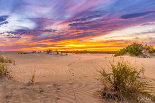 Footprints in the Sand - One of my favorite sunset images from this summer so far. Get lost within the beauty, and walk into the joy and peace where the footprints lead… Jockeys Ridge State Park, Nags Head, NC