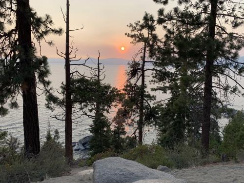 A smokey red sunset on Lake Tahoe, Nevada during the 2021 fire season