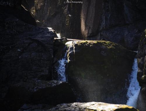 Sun beams shining through at Liberty falls near Chitna, Alaska