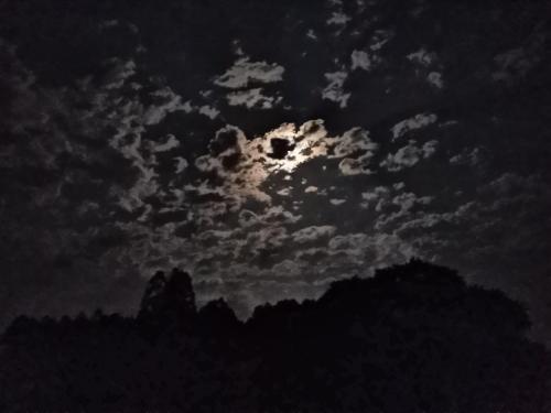 A beautiful full moon with some clouds around Piratuba, SC, Brasil.