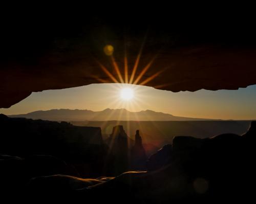 Sunrise through Mesa arch in Canyonlands
