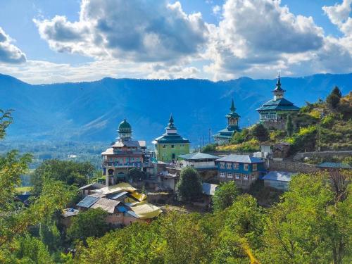 Shrines and Mosques dotting the hill in Aishmuqam, Kashmir
