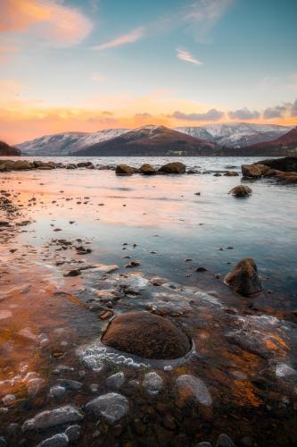 A stunning winter sunset on Ullswater in The Lake District, Cumbria, UK