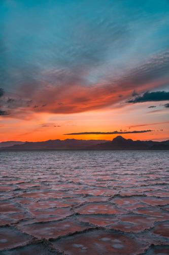 Salty sunset reflections at the Bonneville Salt Flats, Utah, USA  by @explorerhans