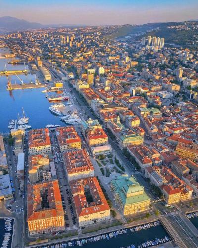 The coastal city of Rijeka, Croatia, sprawling across the hills.