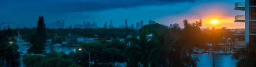 Rainstorm sweeping over the Miami downtown as the sun sets 
