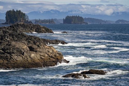 Waves crashing against the beach in Ucluelet, BC, Canada.