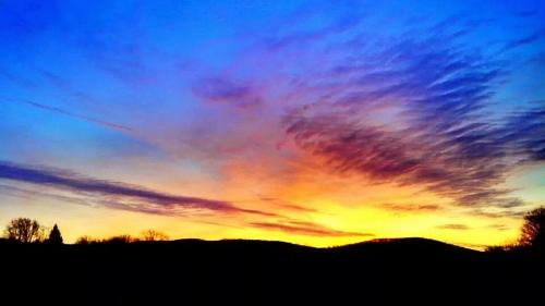 warm&amp;cool sunset over the hills of Caroline NY