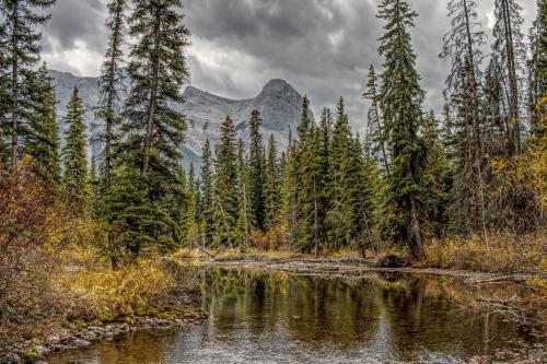 Bow River &amp; Ehagay Nakoda Massif from the Engine Bridge, Canmore, Alberta.