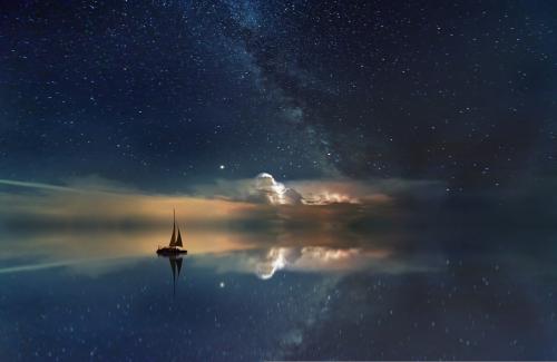 Boat sailing in Milky way galaxy