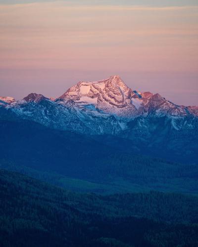 The first light of day hits a peak in western Montana