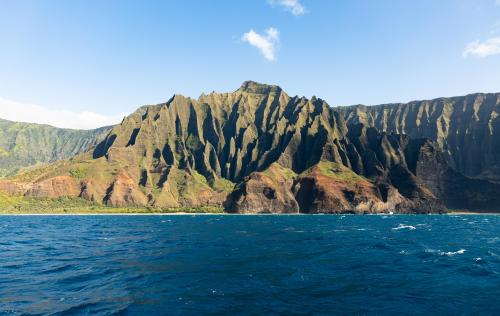 Afternoon shadows highlighting intricately carved cliffs of Napali, Kauai