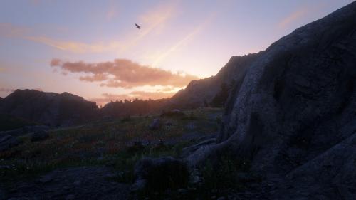 Eagle flying over a mountain range